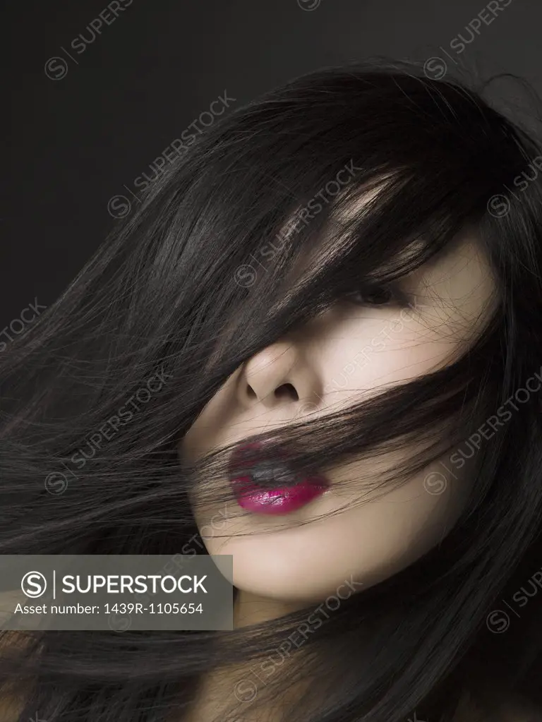 Woman with hair over her face