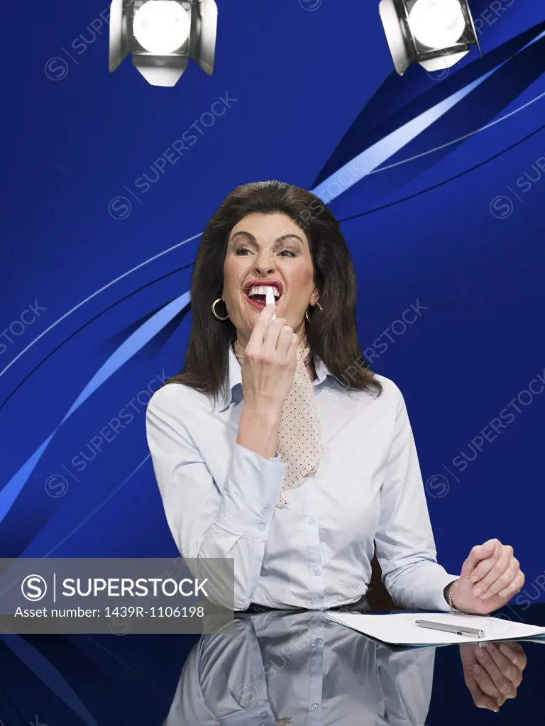 News presenter using tooth whitening pen