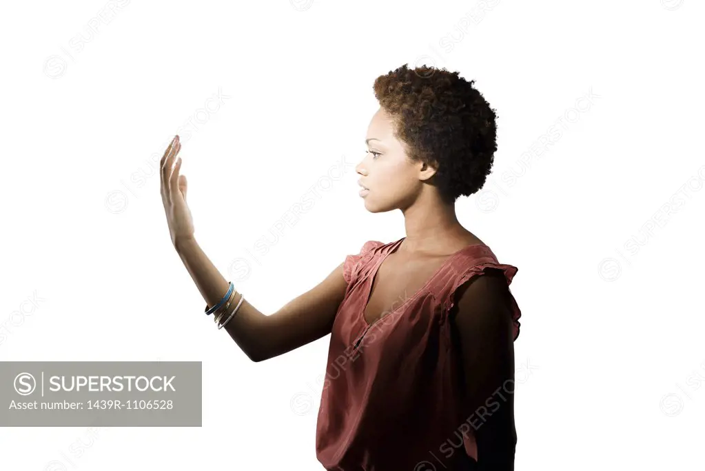 Young woman looking at her hand