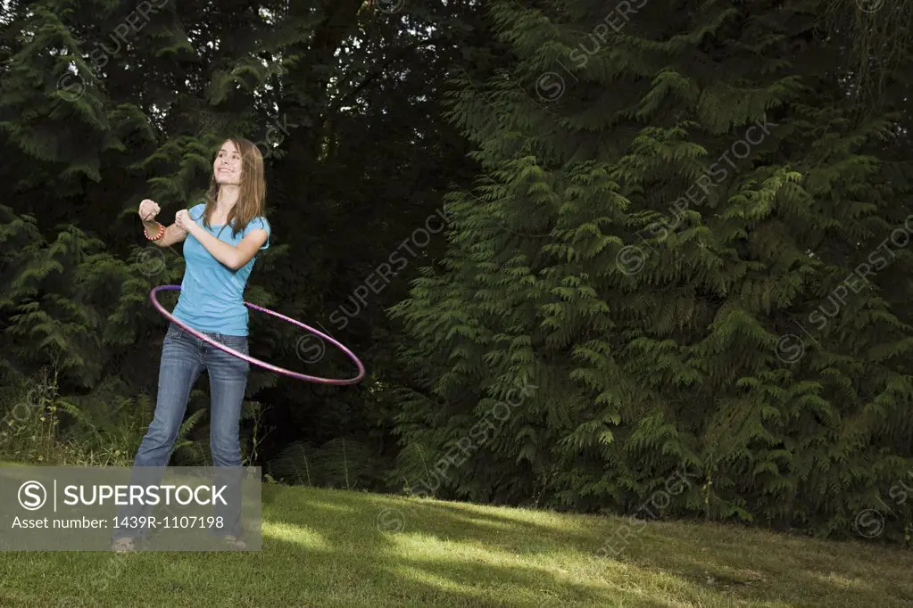 Teenage girl with plastic hoop