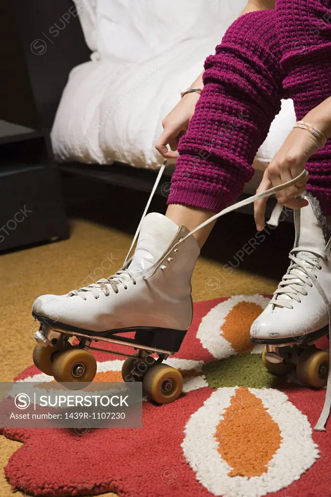 Girl putting on roller skates