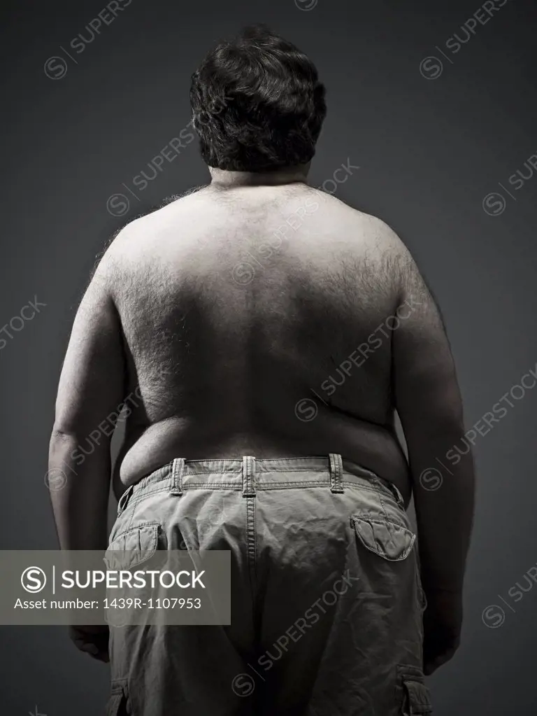 Rear view of overweight man