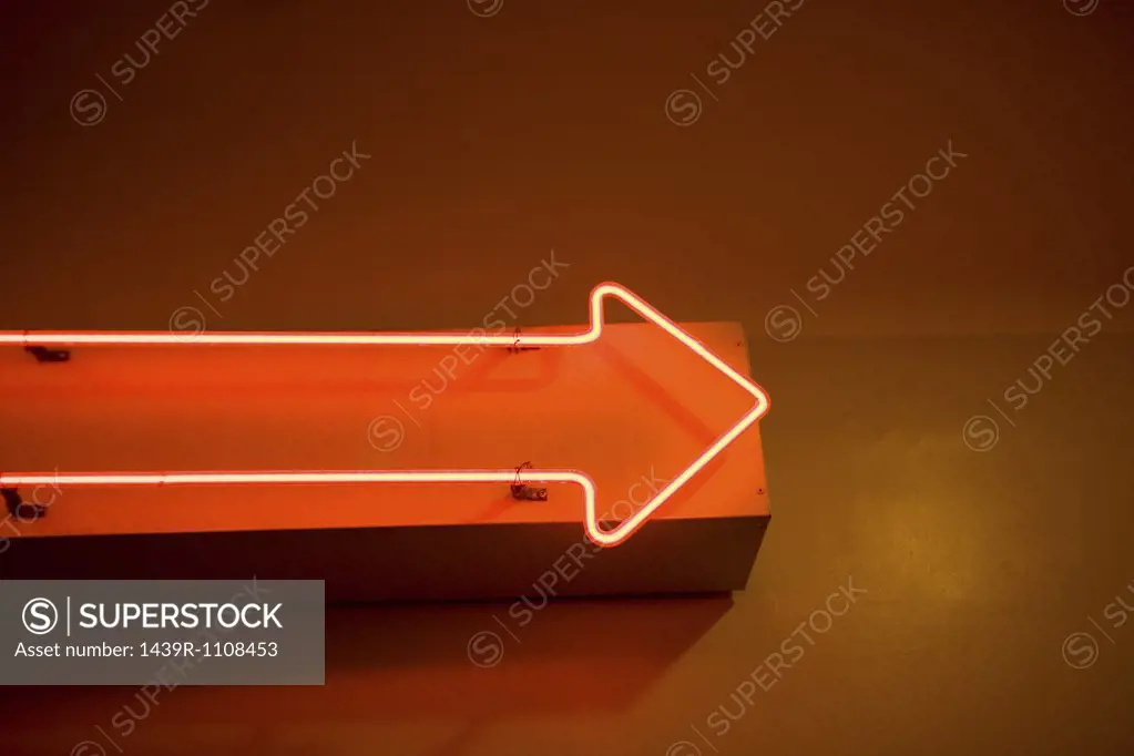 Red arrow neon sign