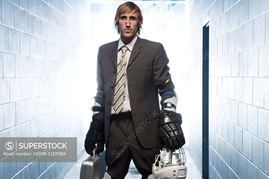 Businessman with an ice hockey uniform