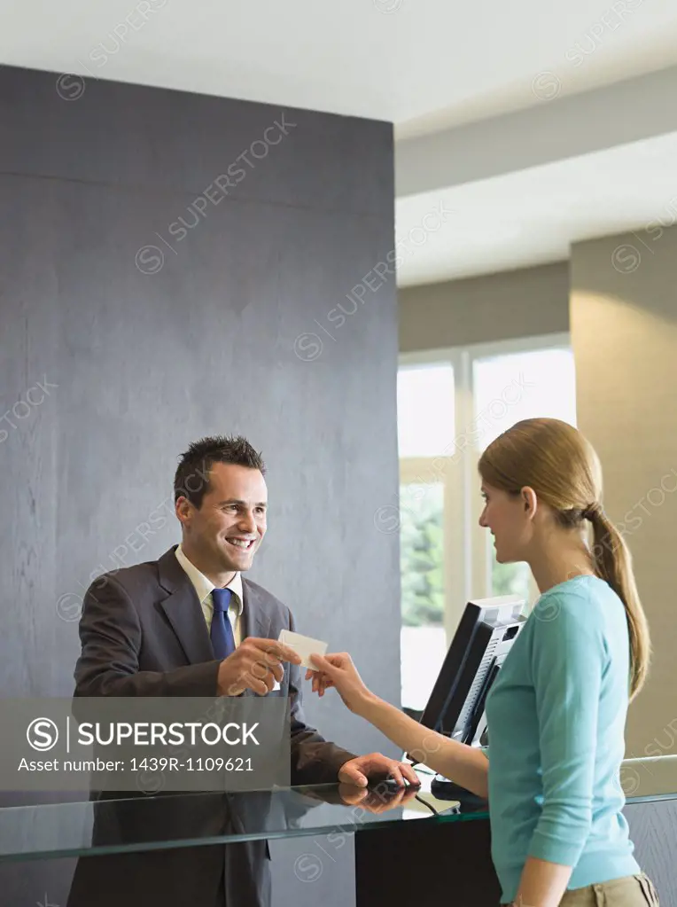 Woman checking into a hotel