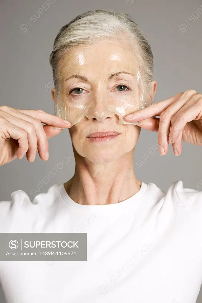 Woman using face mask