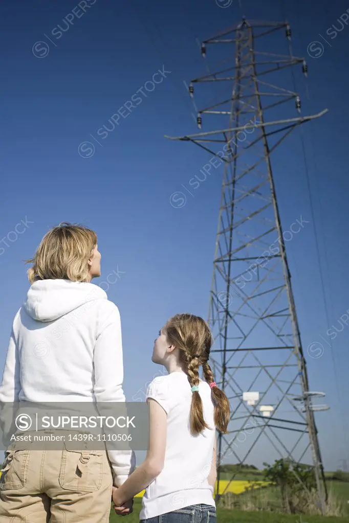 Mother and daughter by pylon