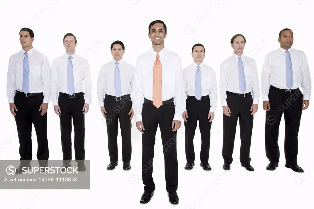 Businessman standing out from the crowd