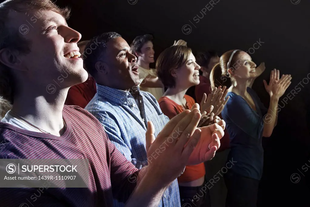 A crowd clapping