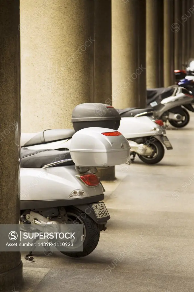 Mopeds in a row