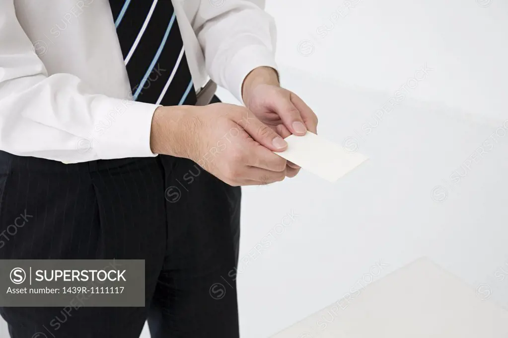 Businessman holding businesscards