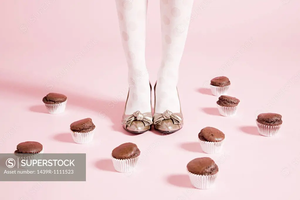 Legs of  woman and cakes