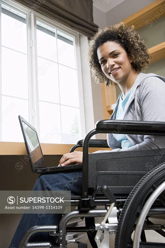 Disabled woman using a laptop computer