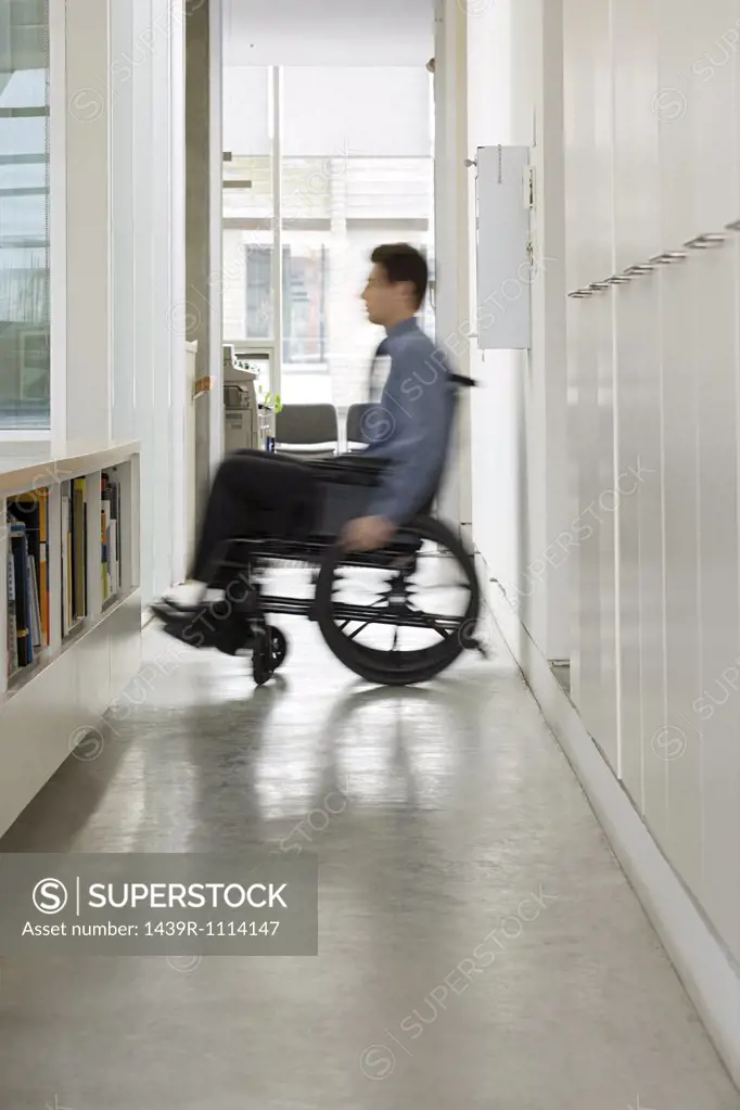 Blurred man in a wheelchair
