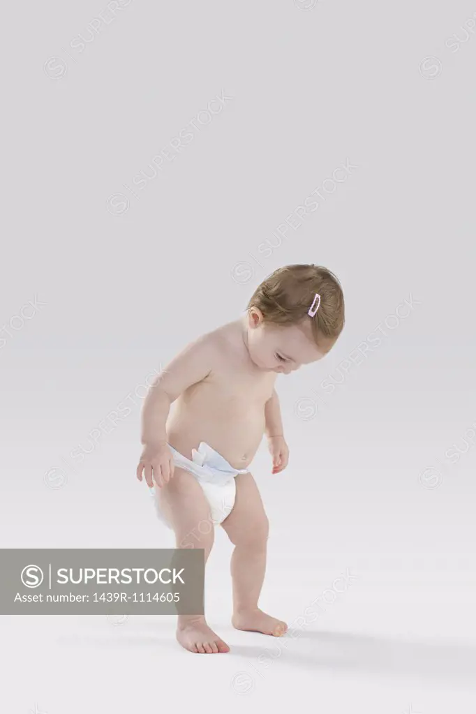 Baby looking at diaper