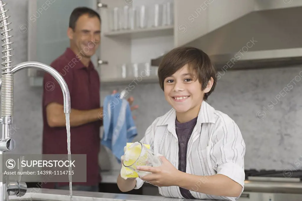 Father and son washing up