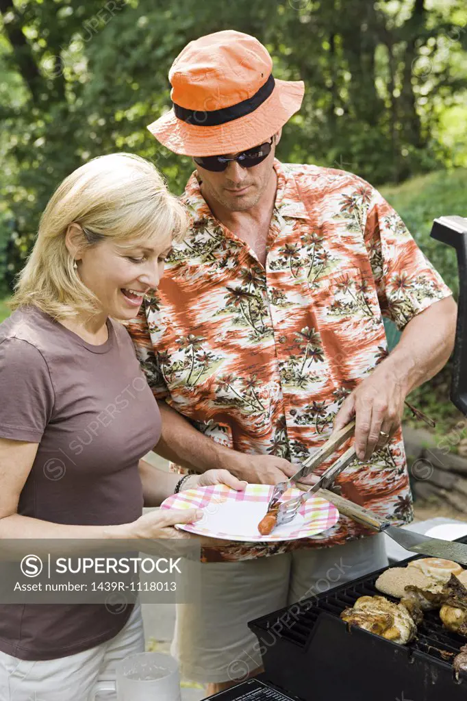 Couple having a barbecue