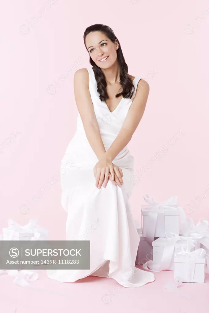 Bride sitting with wedding gifts