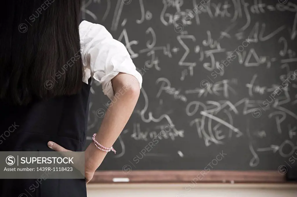 Girl by blackboard