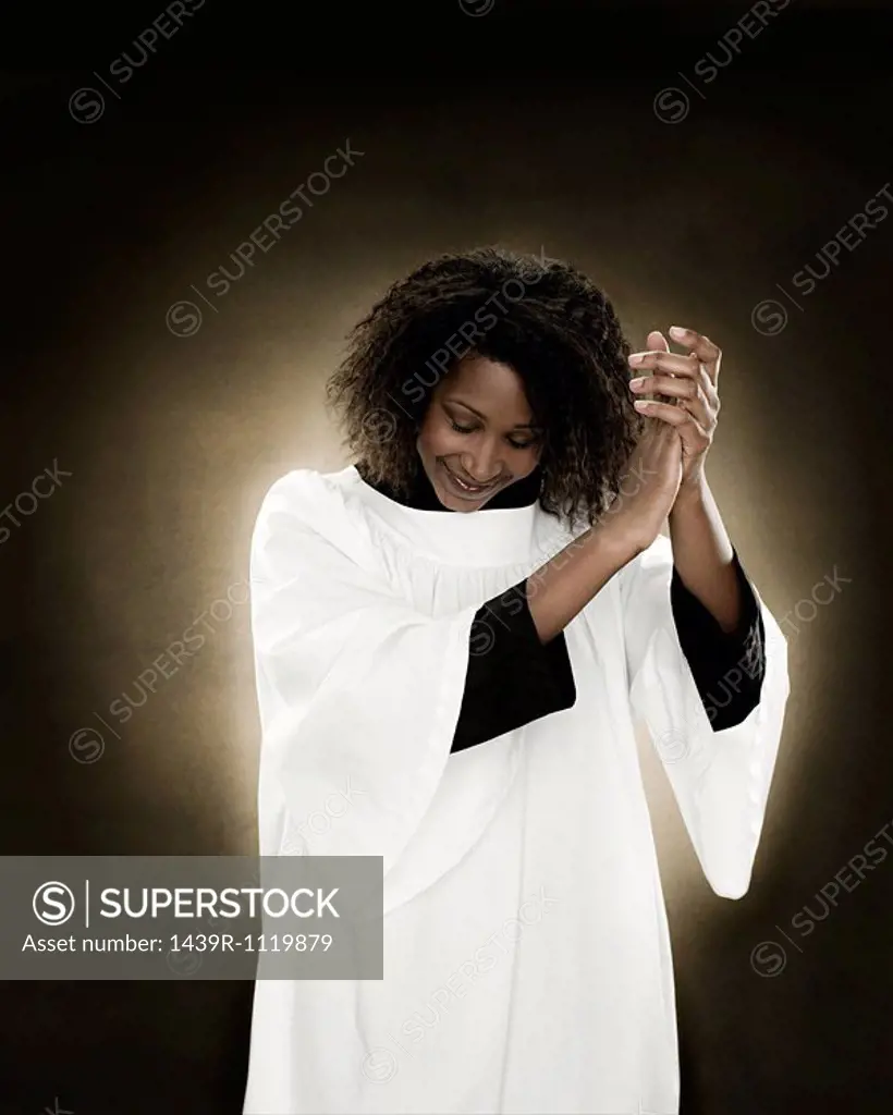 A gospel singer clapping