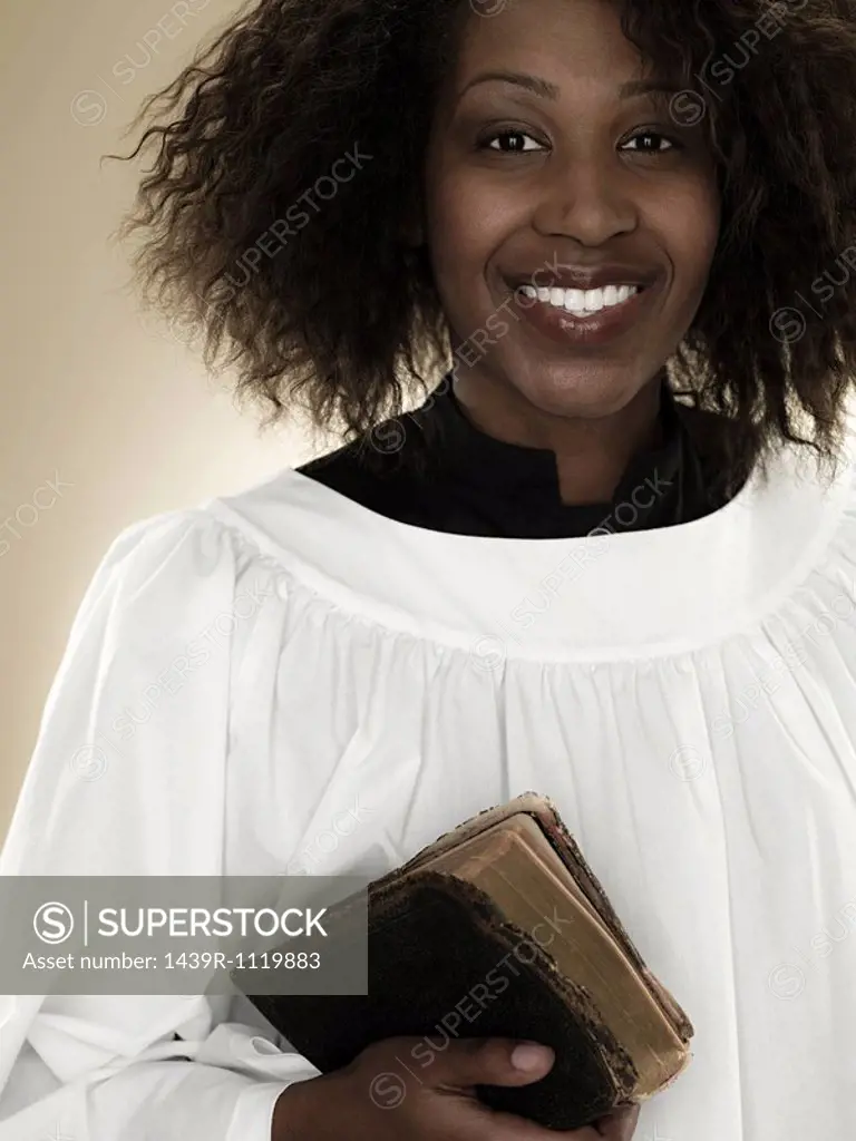 A gospel singer holding a bible