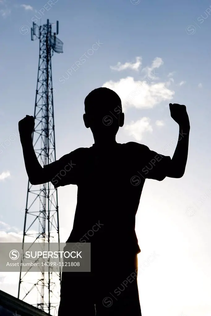 Silhouette of young boy.