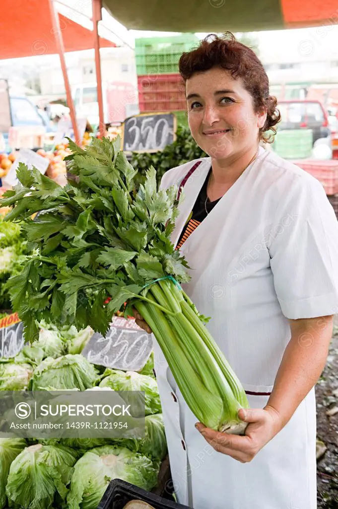 Market trader with celery