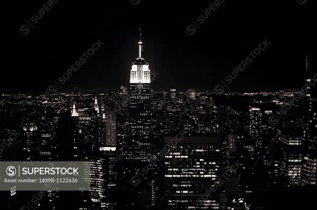 Empire state building and cityscape at night