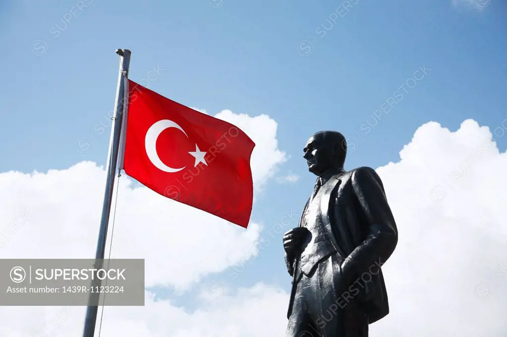 Turkish flag and ataturk statue in kas, turkey