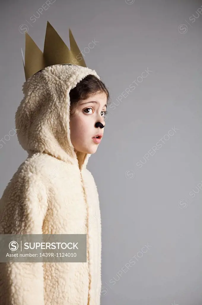 Young girl dressed up as sheep, wearing gold crown