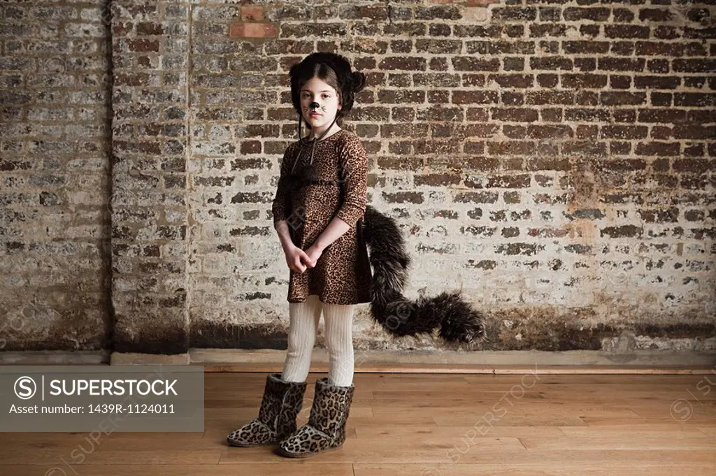 Young girl dressed up as cat