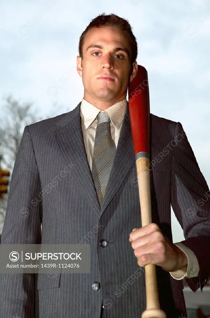Businessman holding baseball bat