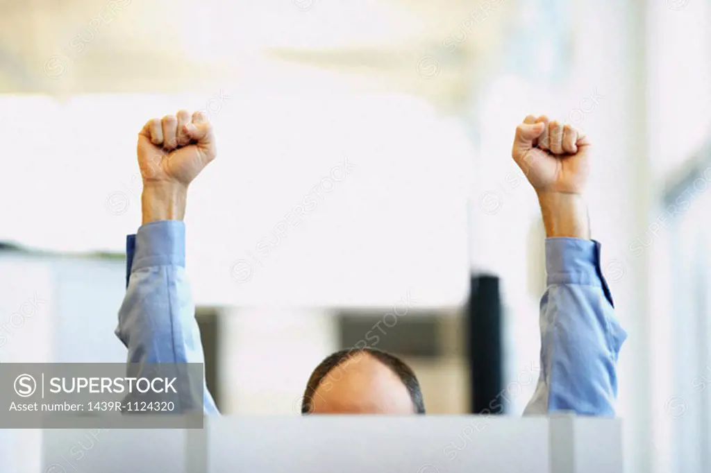 Office worker with raised fists