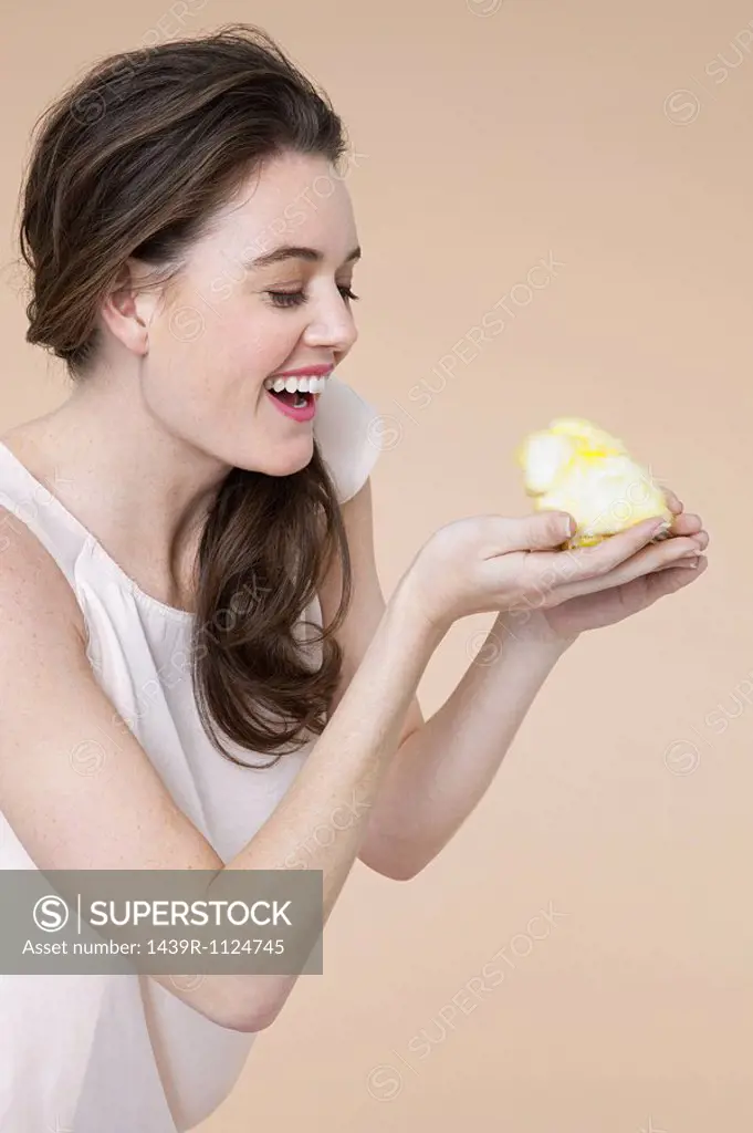 Young woman with easter chick