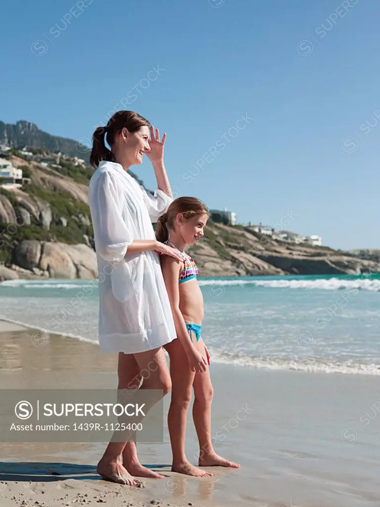 Mother and daughter by the sea
