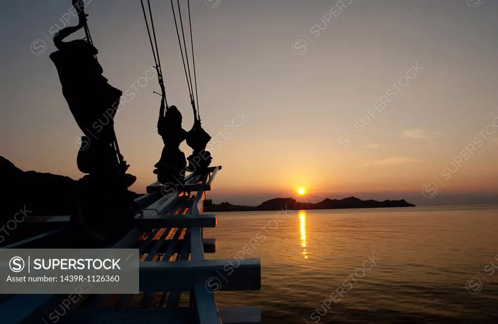 Sailing vessel at sunset.