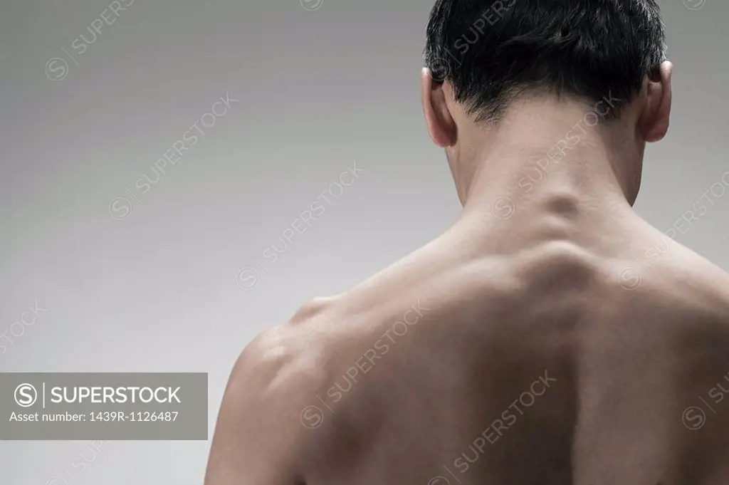 Muscular mature man, rear view
