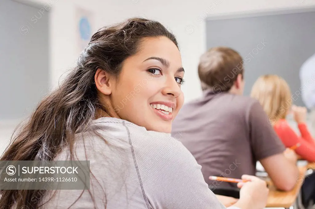 High school student sitting in classroom