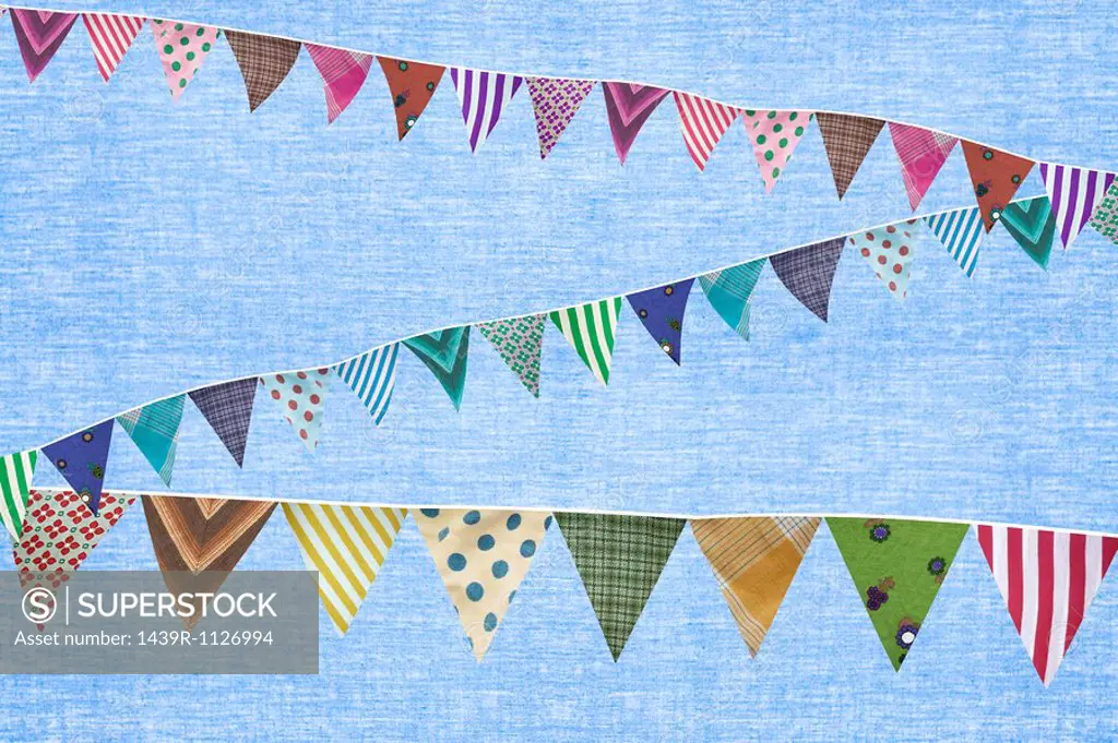 Multi coloured bunting against blue background