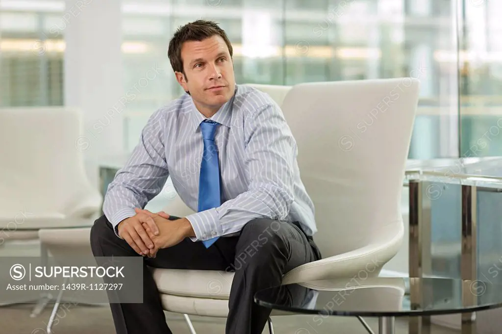Businessman sitting on seat in office