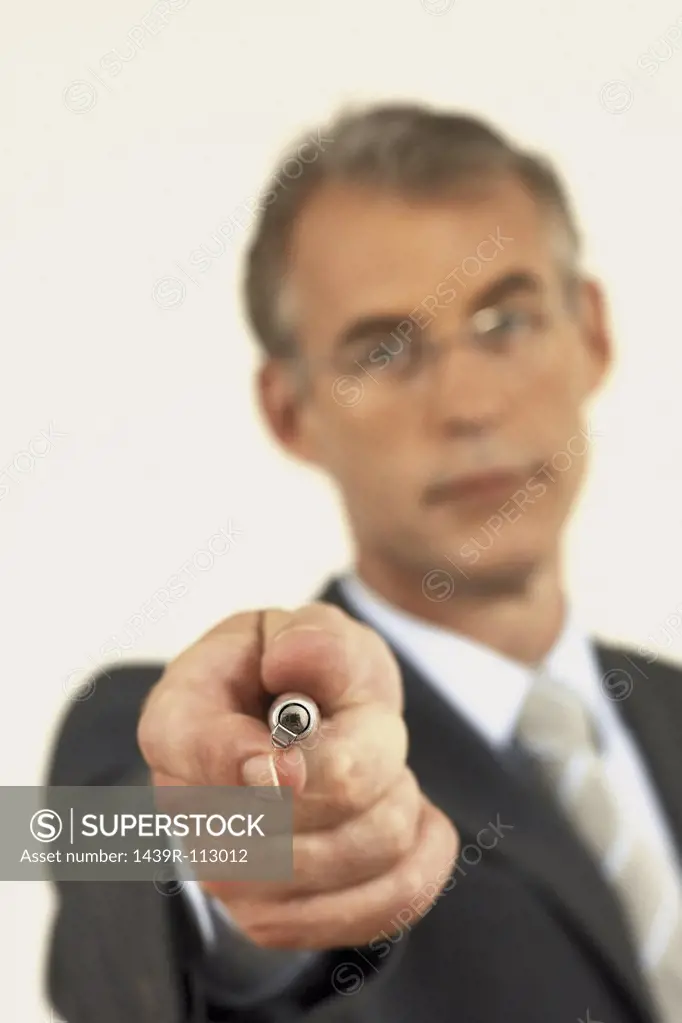 Businessman pointing pen