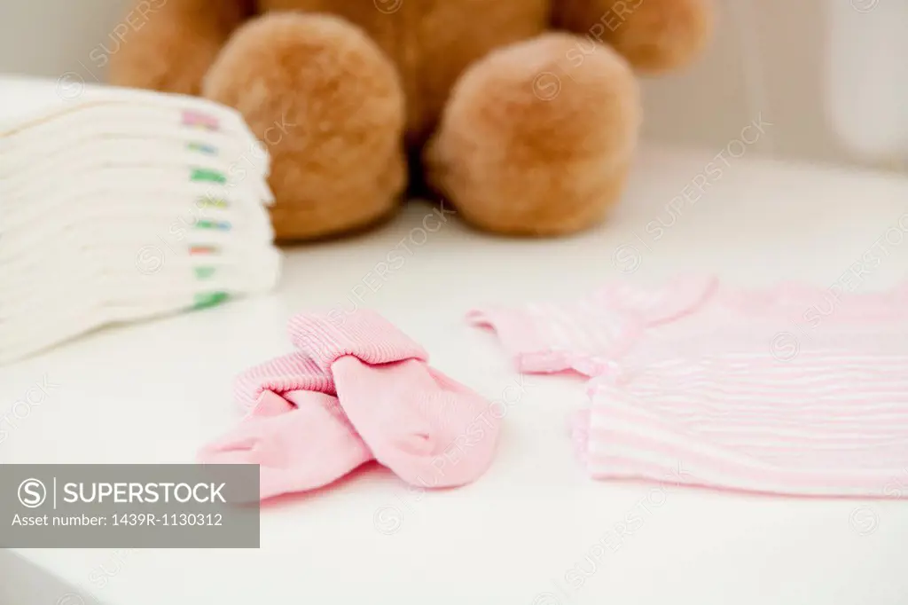 Baby clothes and bear