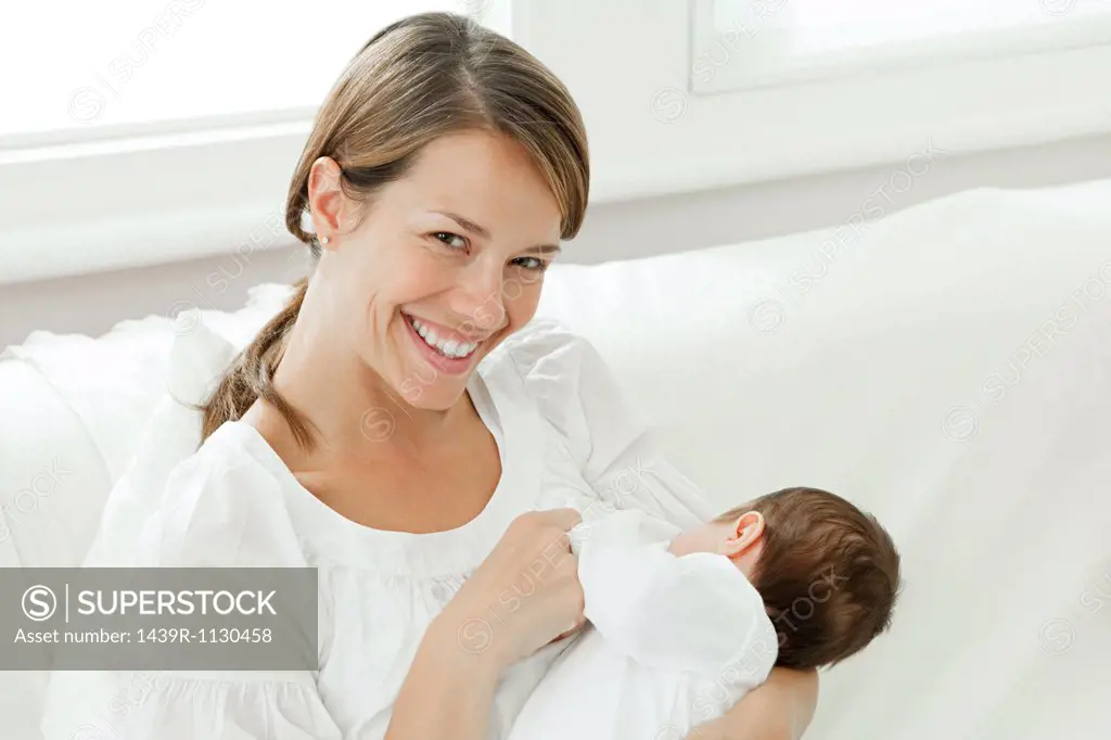 Mother breast feeding baby