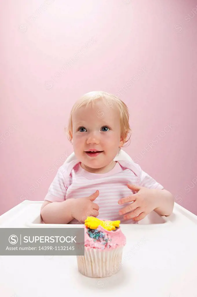 Baby girl with cupcake