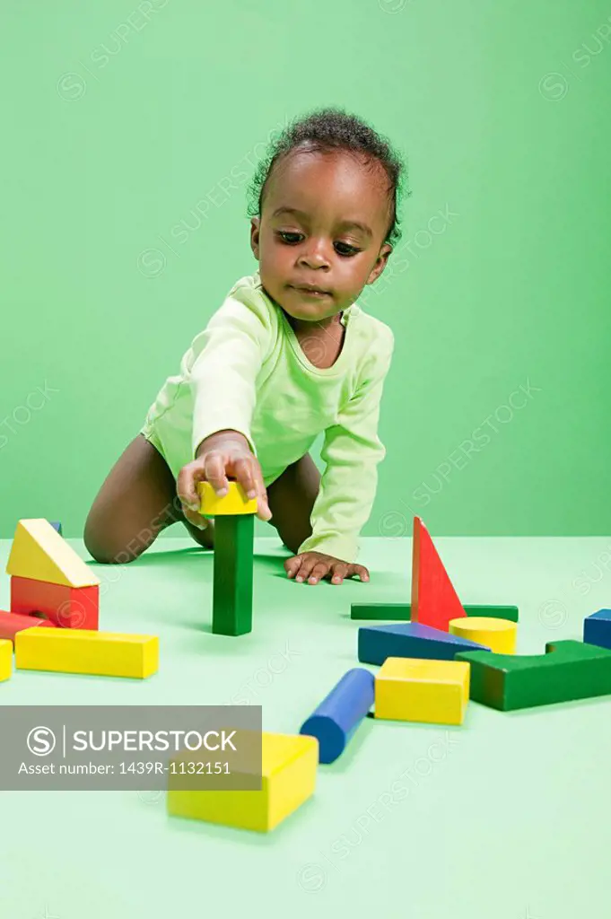 Baby boy playing with building blocks