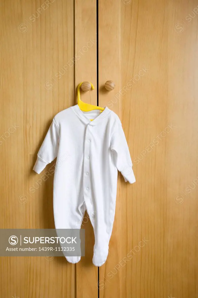 Babygro hanging on wardrobe