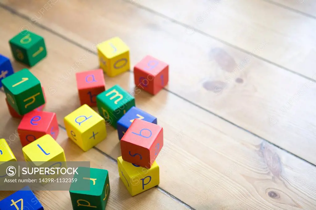 Building blocks on wooden floor