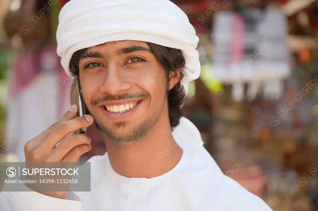 Middle Eastern man using mobile phone