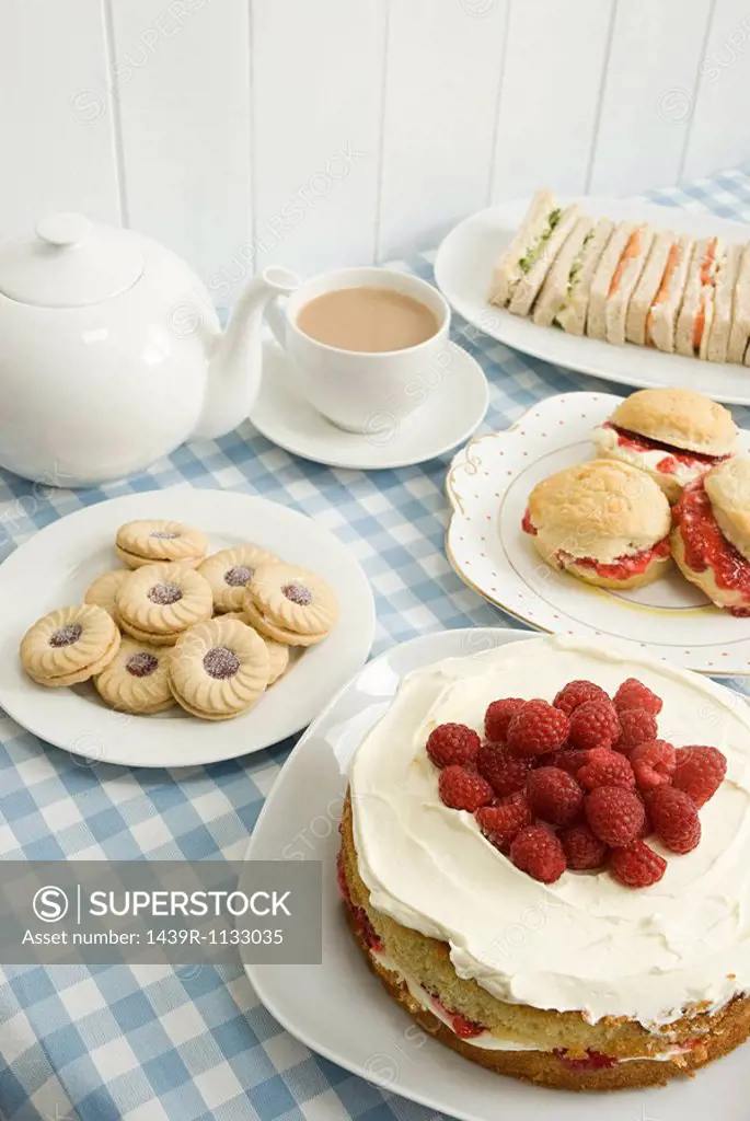 Tea with biscuits and cakes
