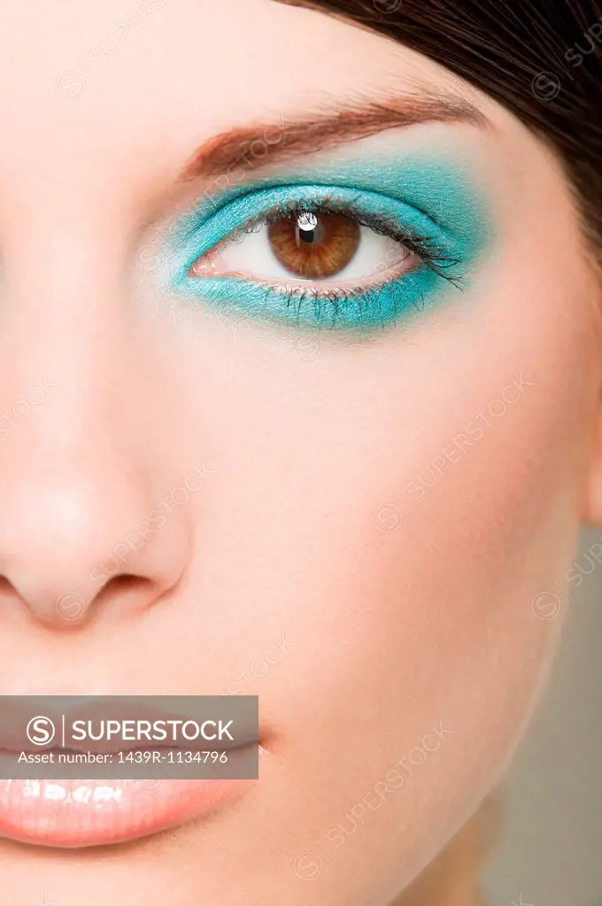 Young woman with turquoise eyeshadow